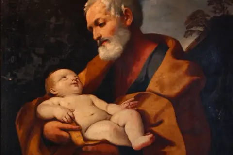Święty Józef trzyma na rękach Dzieciątko Jezus. Obraz przypomina o modlitwie litania do św Józefa.